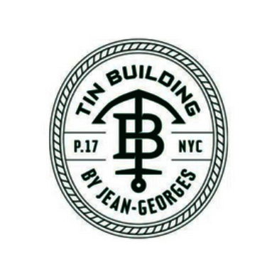 The Tin Building by Jean-Georges logo
