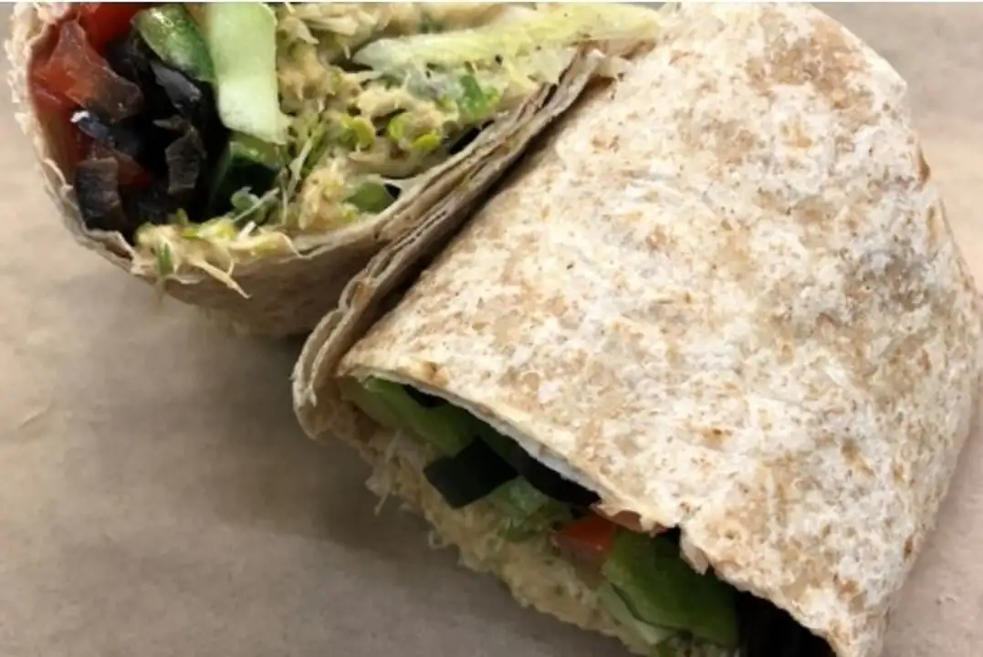 Order WFC Deli Veggie Hummus Wrap food online from Whole Foods Co-Op Denfeld store, Duluth on bringmethat.com