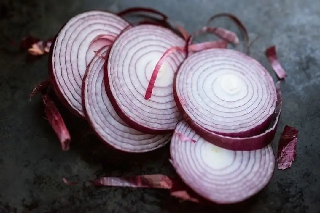 Order Sliced Red Onion - 1 Ounce food online from Holiday farms store, Roslyn Heights on bringmethat.com