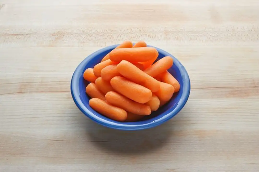 Order Baby Carrots - 1 Pound food online from Fligner Market store, Lorain on bringmethat.com
