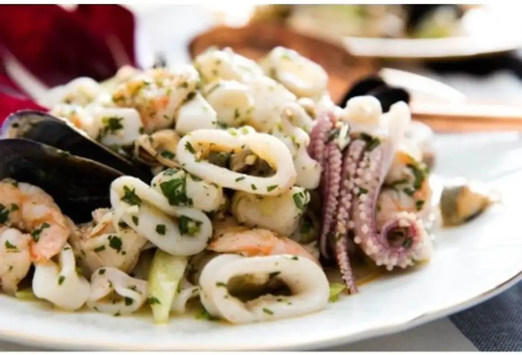 Order Fish Salad - Half Tray food online from Meats Supreme store, Brooklyn on bringmethat.com