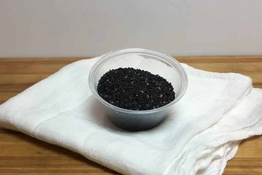 Order Black Sesame Seeds - 2.25 Ounces food online from Holiday farms store, Roslyn Heights on bringmethat.com