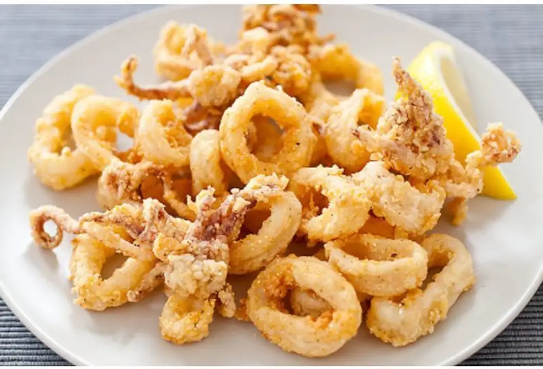 Order Fried Calamari - Half Tray food online from Meats Supreme store, Brooklyn on bringmethat.com
